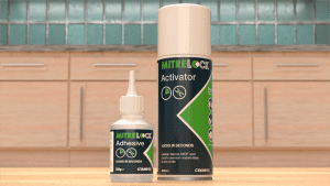 Mitrelock activator and glue against the backdrop of a kitchen.